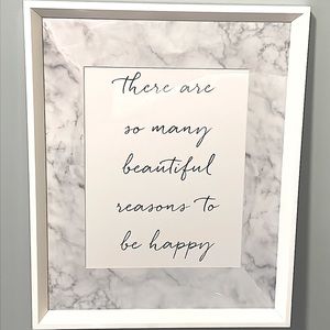 White wood frame with glass. “There are so many beautiful reasons to be happy”